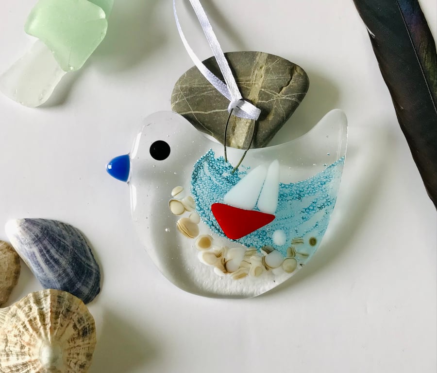 Fused glass bird with boat on the sea