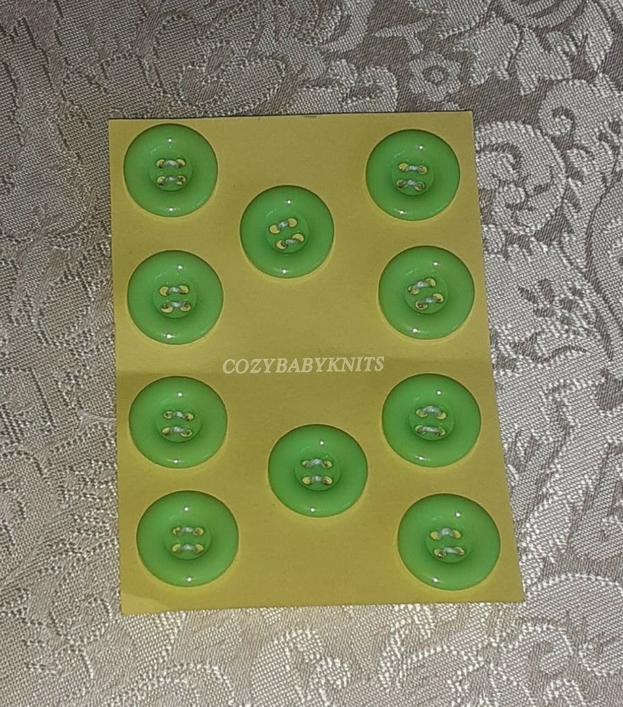 18MM PALE GREEN ROUND BUTTONS WITH FOUR HOLES FOR ATTACHING 