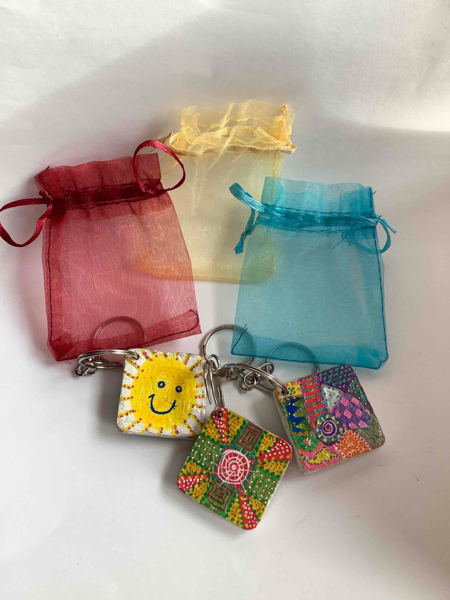 3 wooden hand decorated arty keyrings 