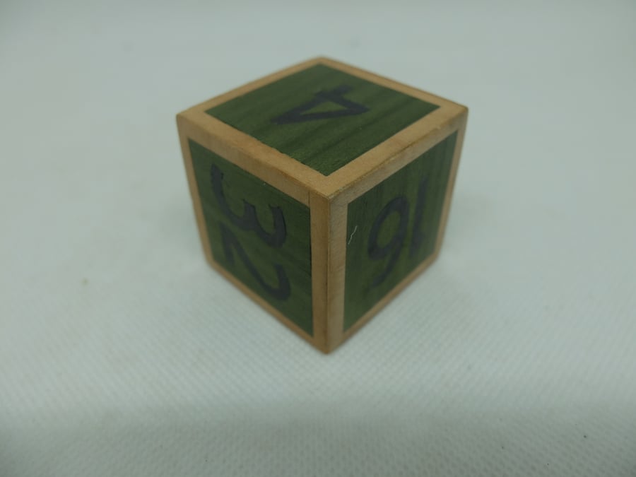 Green veneered wooden doubling cube