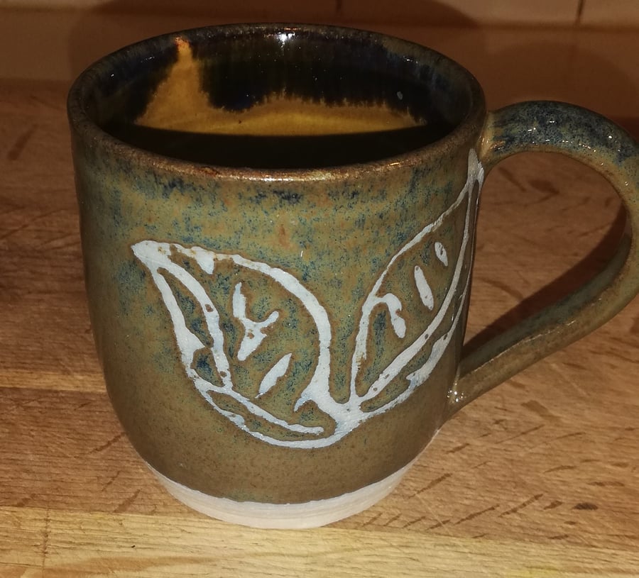 Leaf wax resist decorated mugs