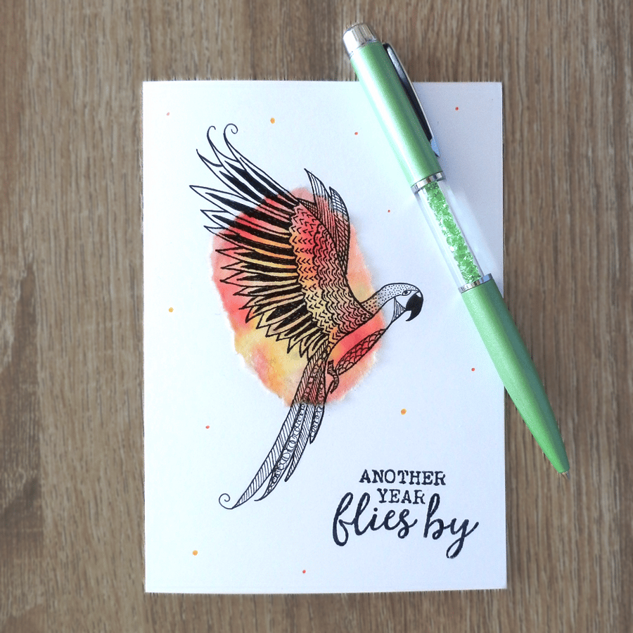 Flying bird, parrot, blank card for any occasion, another year flies by