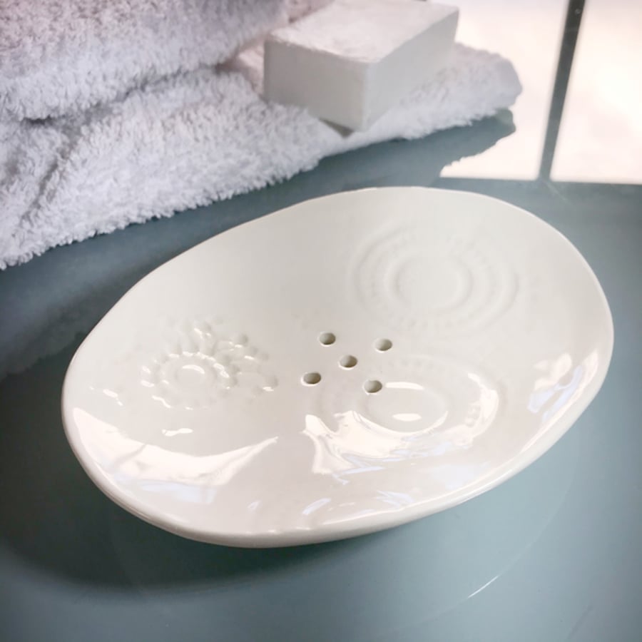 Ceramic handbuilt oval soap dish with impressed vintage lace pattern.