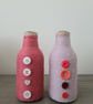 Set Of 2 Pink Yarn Wrapped Bottles With Contrasting Buttons