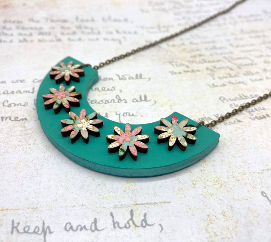 Aqua and pink washi paper flowers on curve wooden necklace