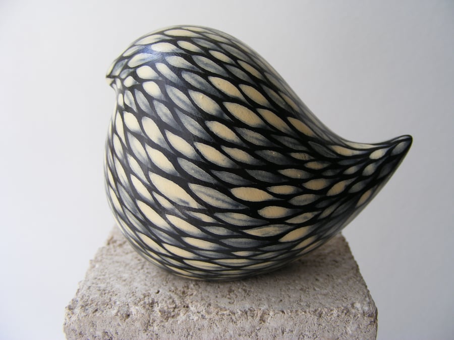 Painted round bird, (cream on black)