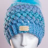 Hand made crochet puff stitch hat with handmade faux fur detachable pompom blue