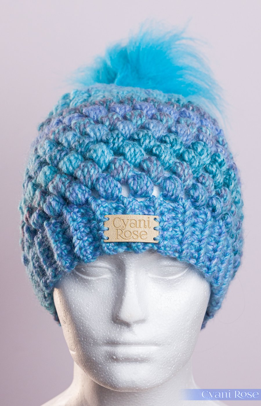 Hand made crochet puff stitch hat with handmade faux fur detachable pompom blue