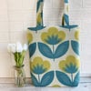 Floral tote bag with stylised yellow-green and turquoise flowers