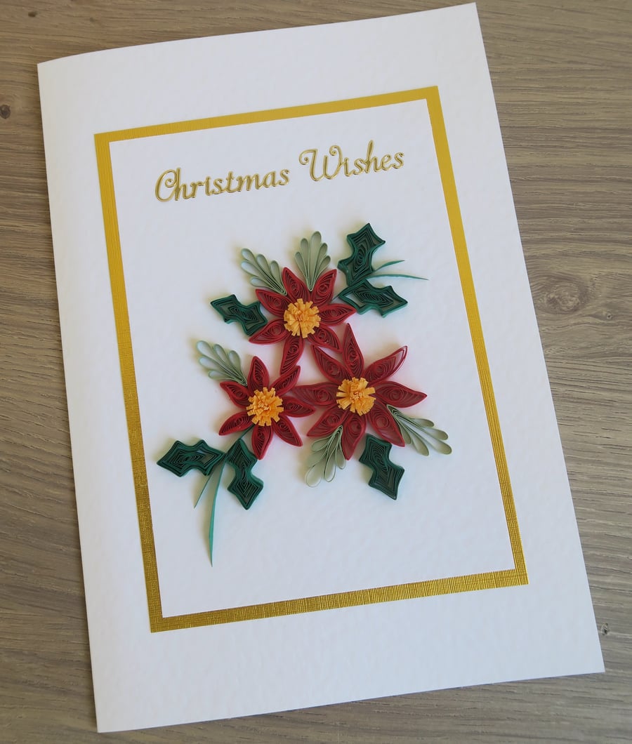 Handmade, quilled Christmas card, with poinsettias and holly