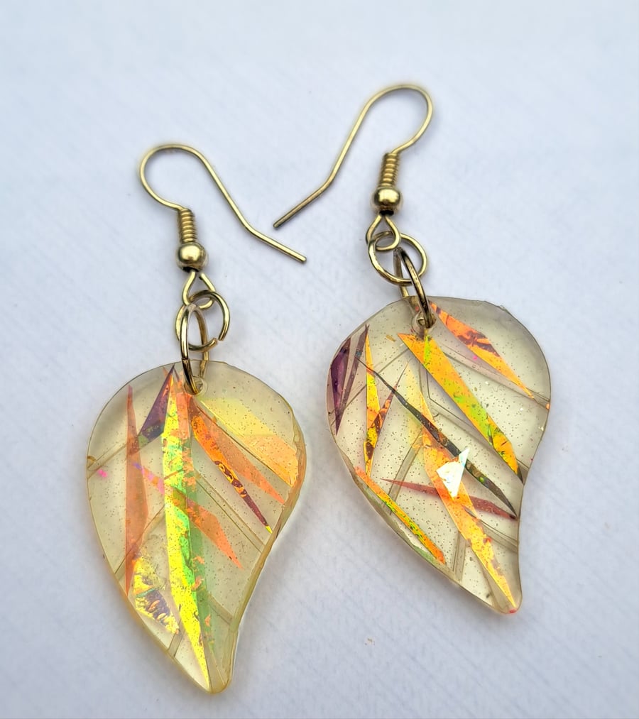 Beautiful resin leaf shaped dichroic filmed earrings.
