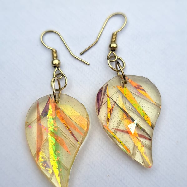 Beautiful resin leaf shaped dichroic filmed earrings.