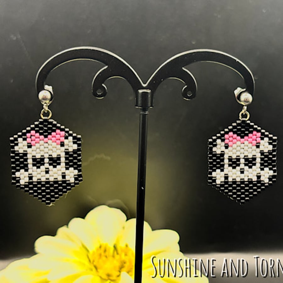 Handmade Brick Stitch Drop Earrings - Skull and Crossbones with Pink Bow