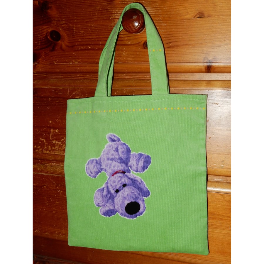 Green tote bag with cute dog