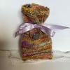 Unique knitted gift bag with silver button