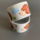 Deep edge ceramic hedgehog food and water bowls. 