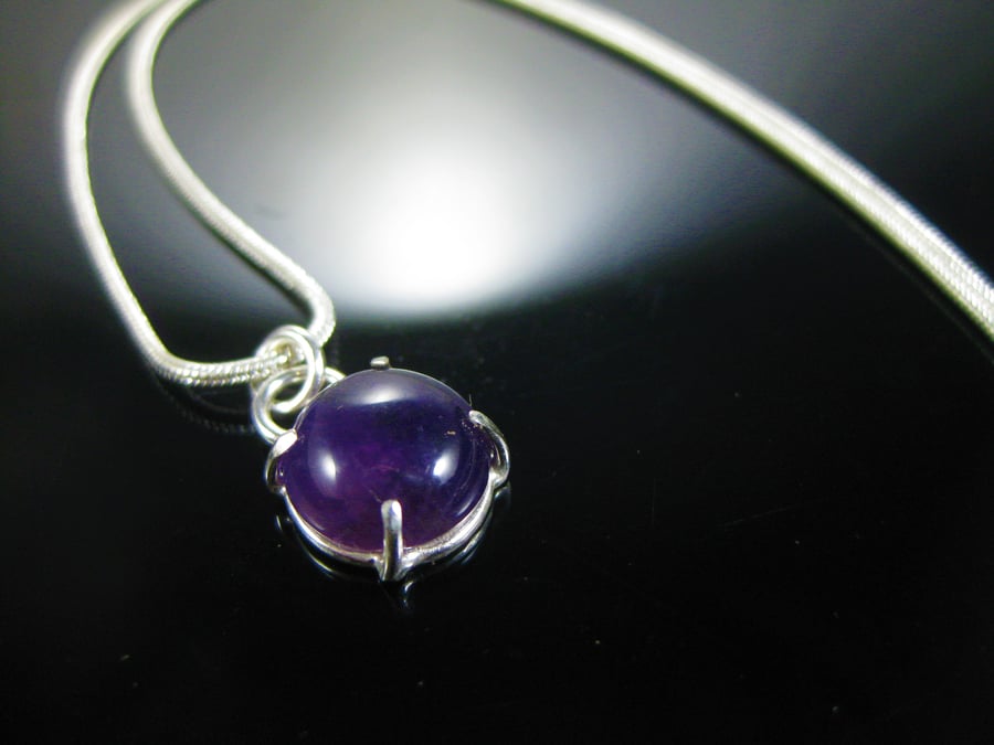 Purple amethyst and silver pendant