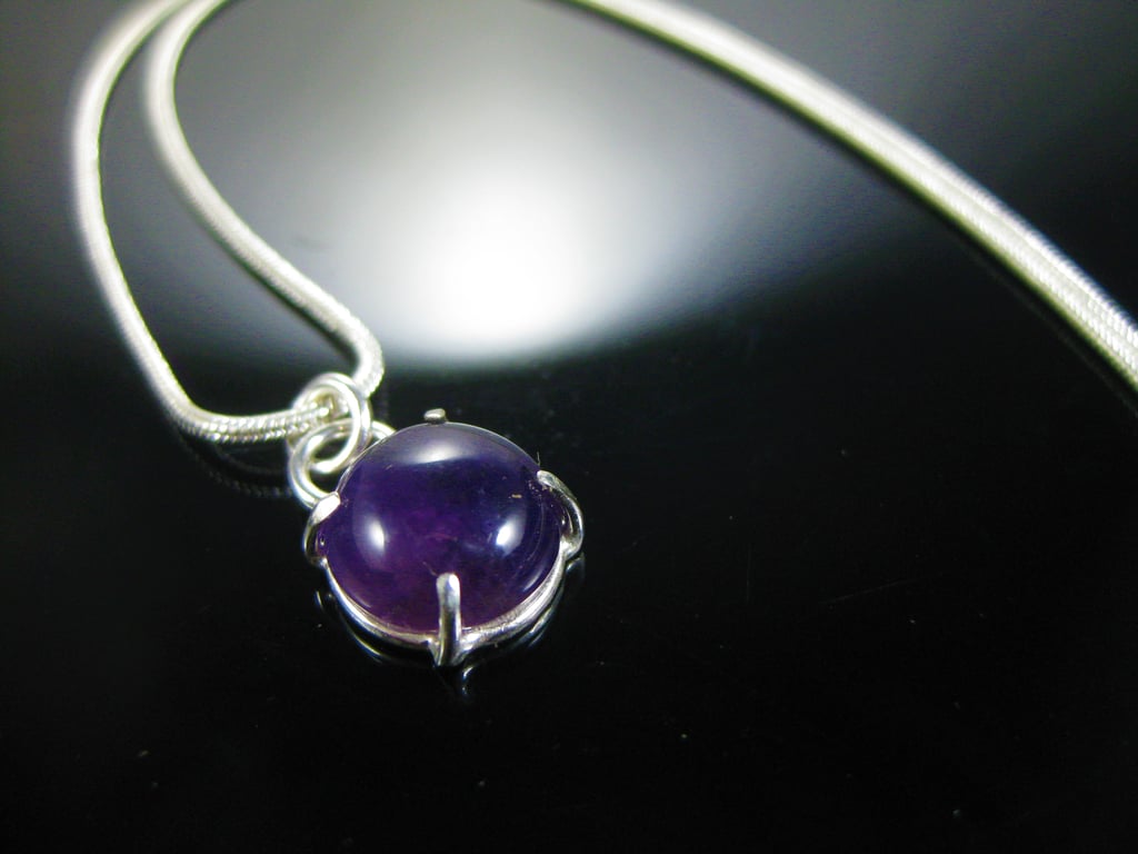 Purple amethyst and silver pendant