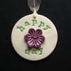 Ceramic decoration Happy Day with flower button