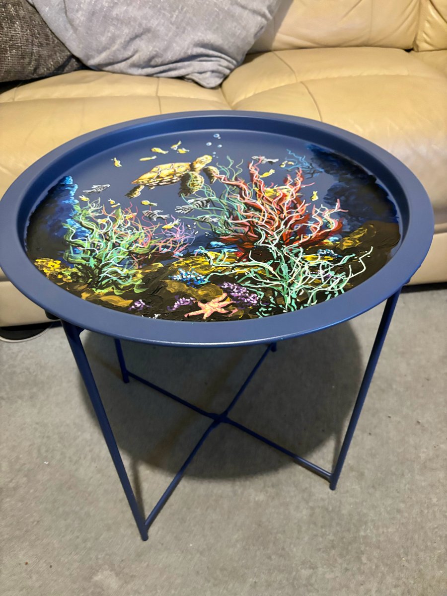 A hand painted and sealed metal folding table by Andrew Jenkins 