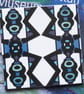 Blue and Black Bold Geometric Pattern Ceramic Tile Trivet with Cork Backing - Image 1