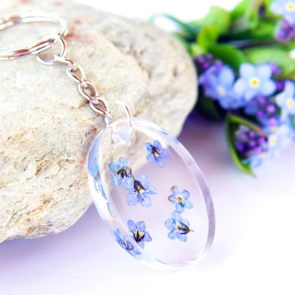 oval resin keyring with real forget me not flowers 