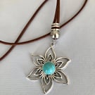 Flower pendant on necklace