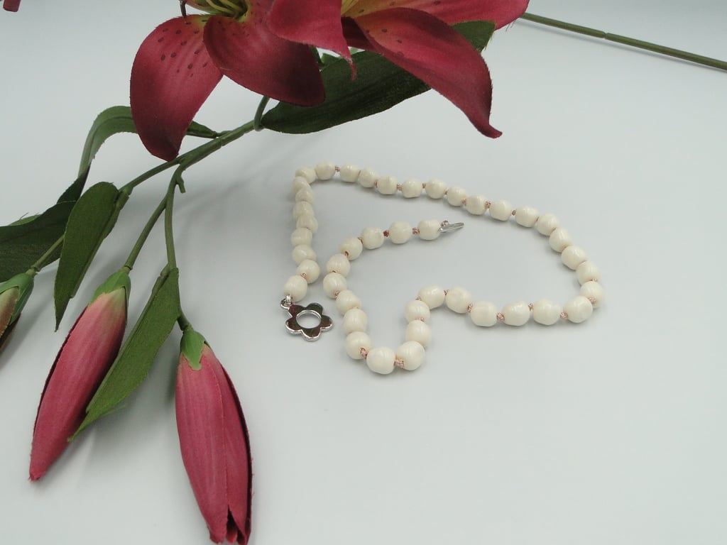 Cream pearl necklace  Traditionally knotted with pink silk thread 
