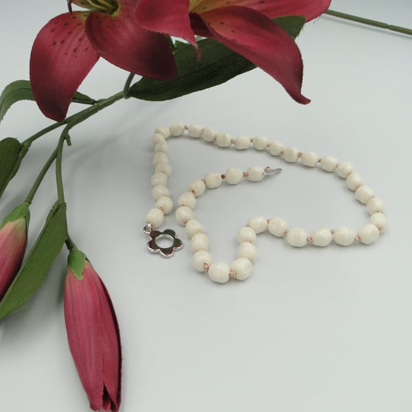 Cream pearl necklace  Traditionally knotted with pink silk thread 