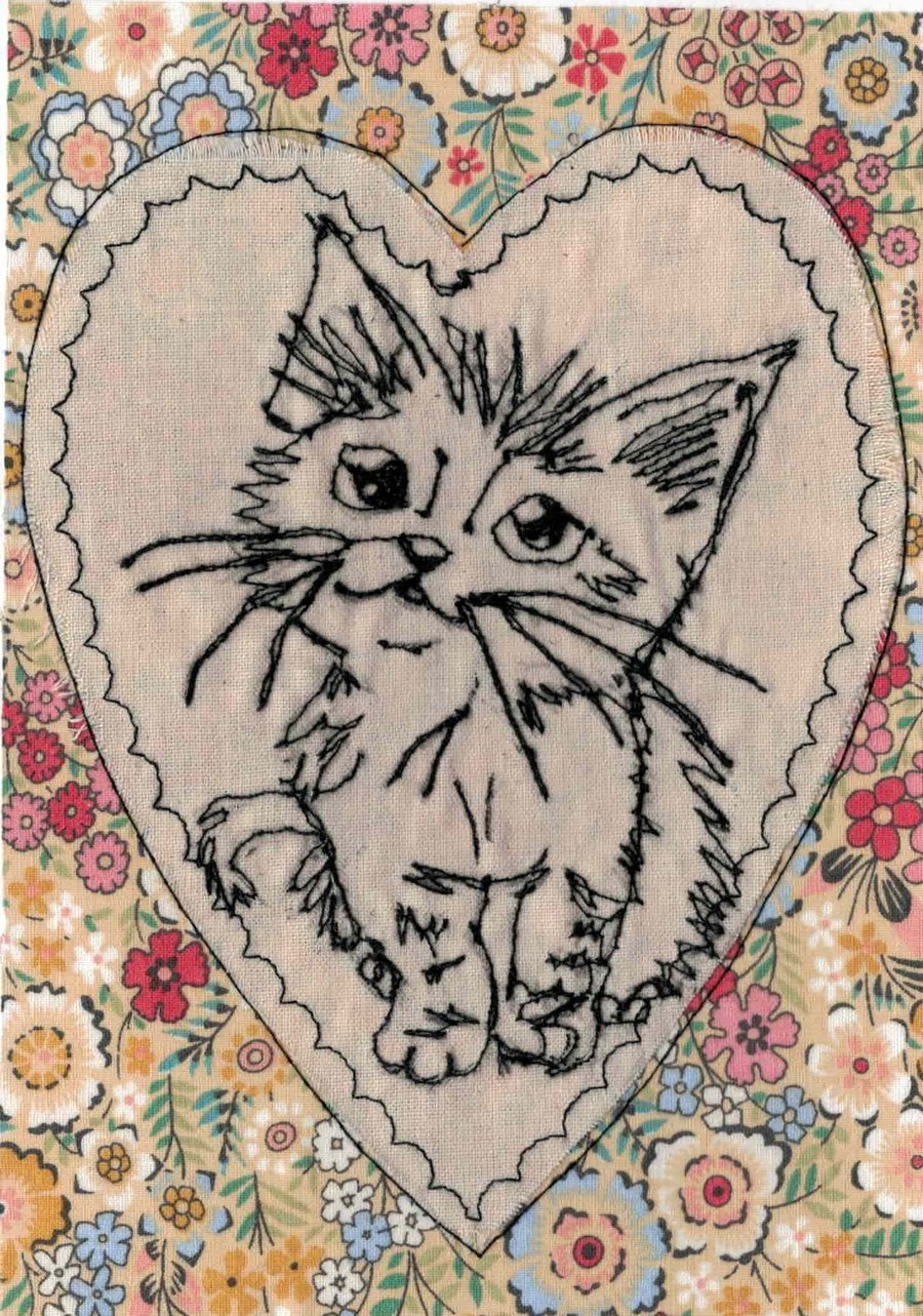 Cute kitten in a heart