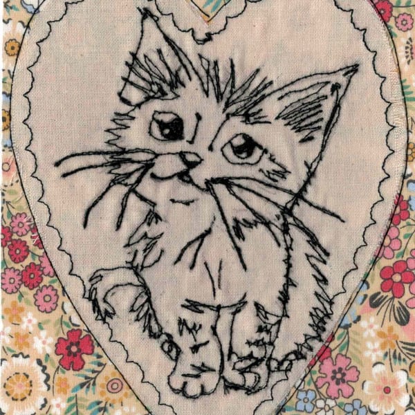 Cute kitten in a heart