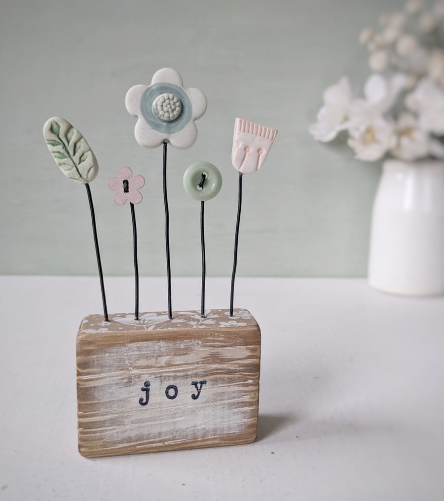 Clay Flowers and Buttons in a Painted Wood Block 'Joy'