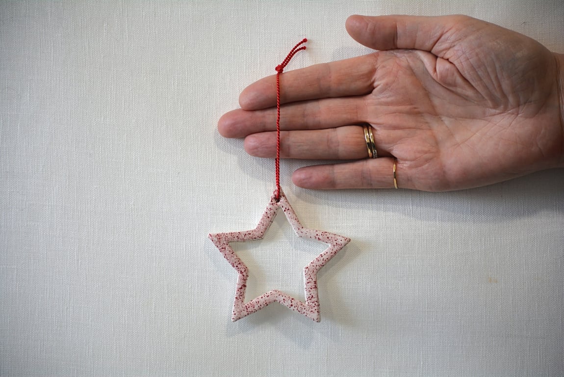 Star tree decoration with red speckled detail