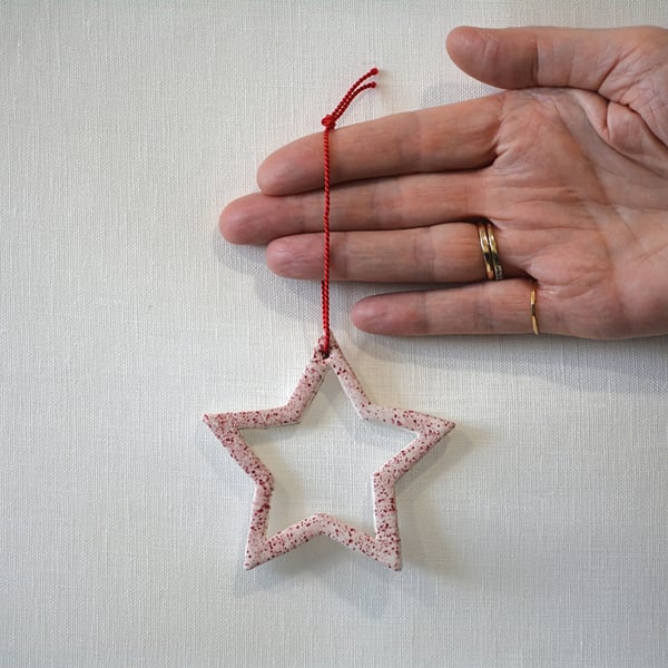 Star tree decoration with red speckled detail