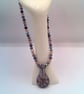 Purple Floral Patterned Glass Pendant on a Mixed Purple Crystal Necklace - Image 8
