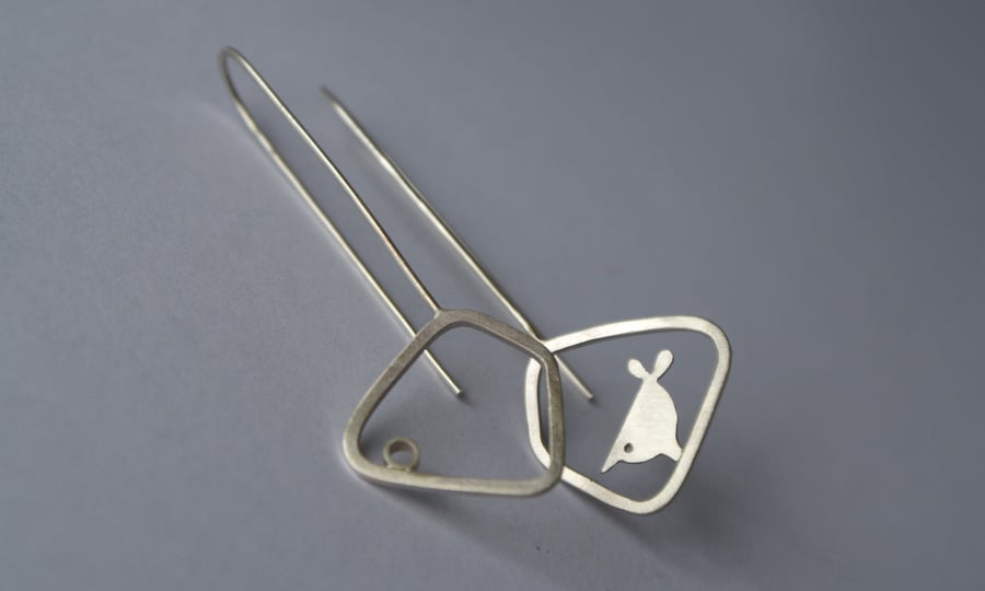 Silver pecking bird mismatched earrings