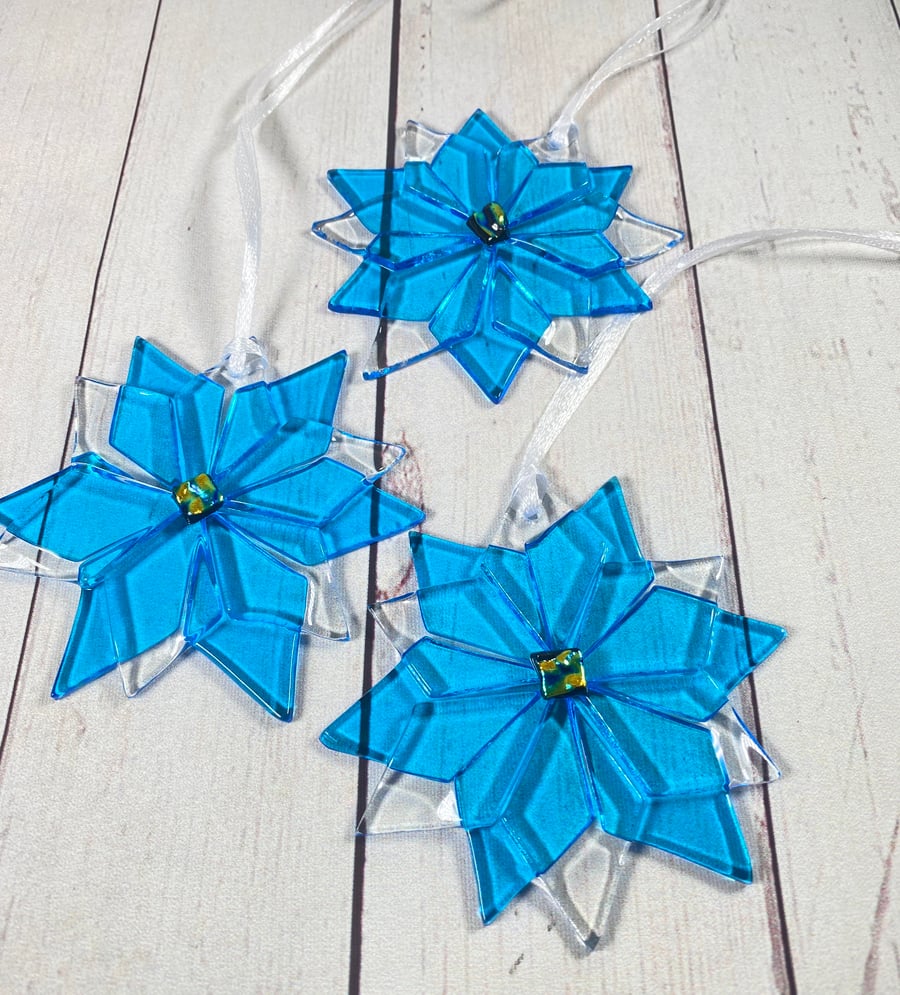 Large blue snowflake flower with dichroic glass