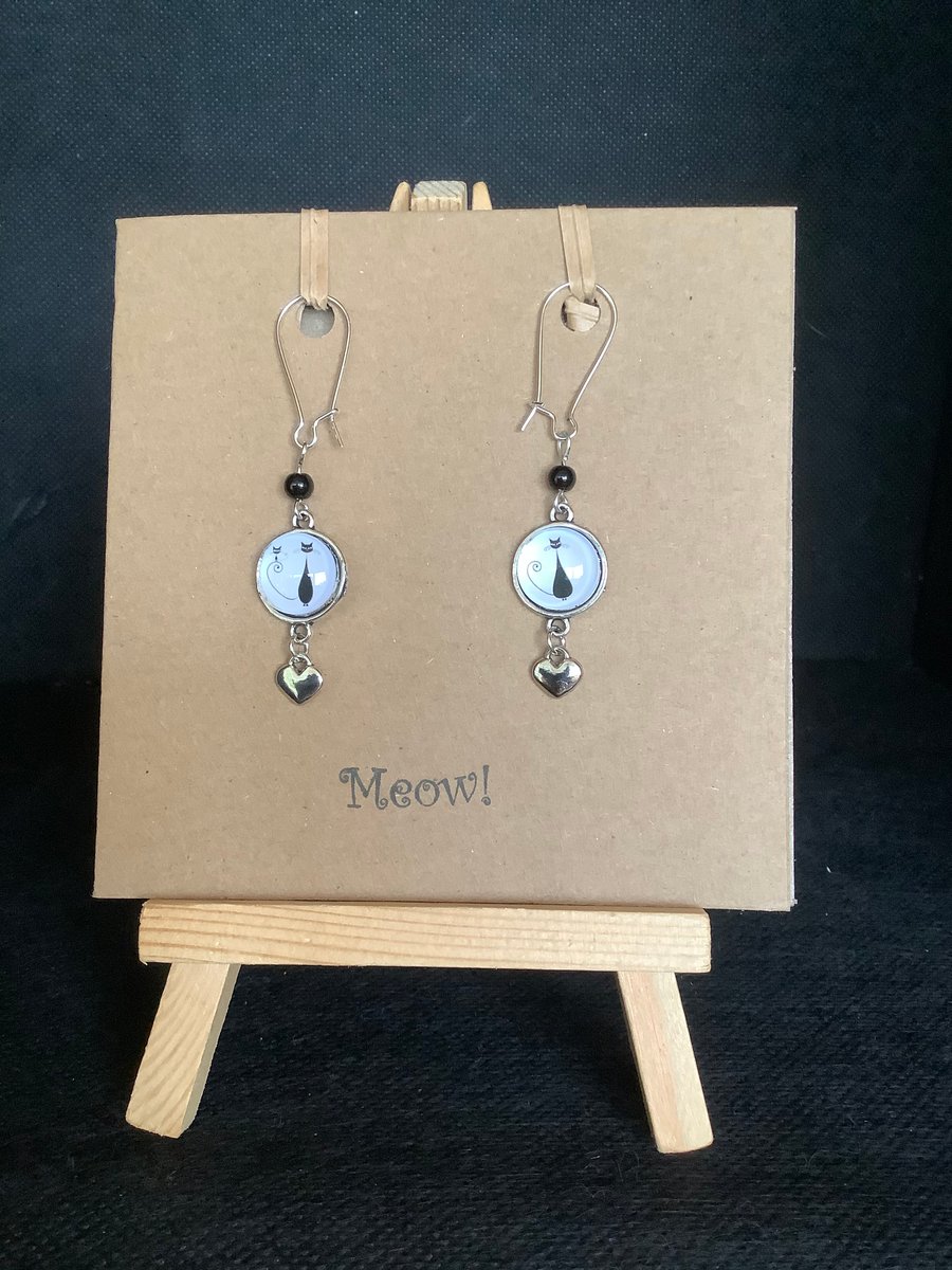 Handmade drop earrings with cabochon, Tibetan silver charm and beads.