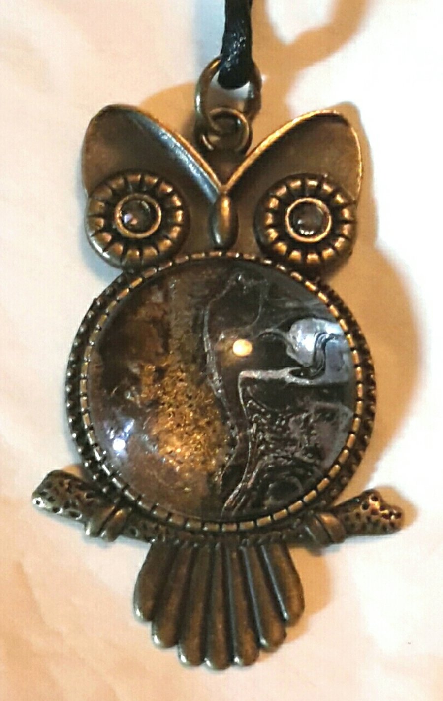 Unusual handmade fluid art Owl pendant, Silver and gold on black.
