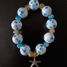 Elasticated chunky beaded nautical bracelet with starfish charm