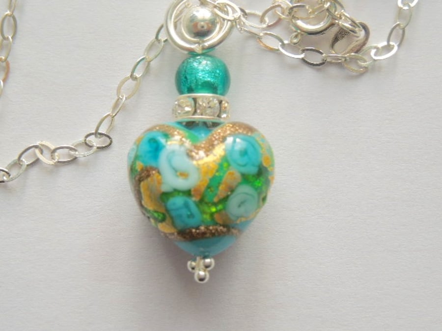 Murano glass pendant with gold and blue heart Swarovski and sterling silver.
