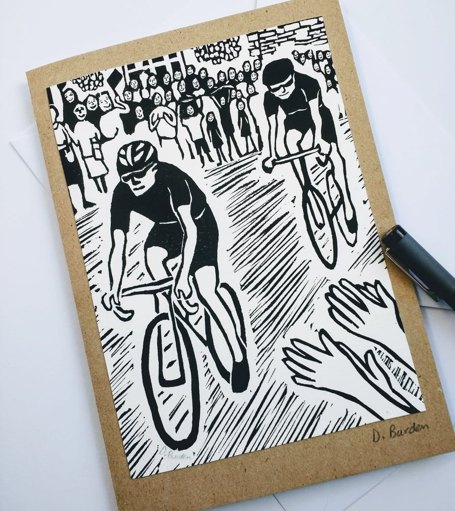 Handmade, hand-printed linoprint card of cyclist. 