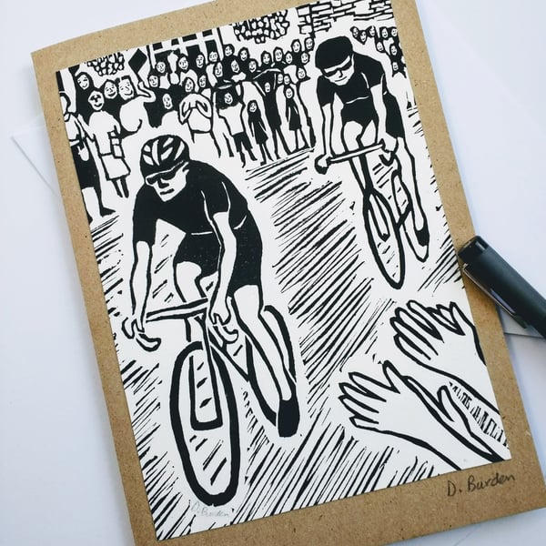 Handmade, hand-printed linoprint card of cyclist. 
