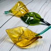 fused glass  ornamental curved leaves.