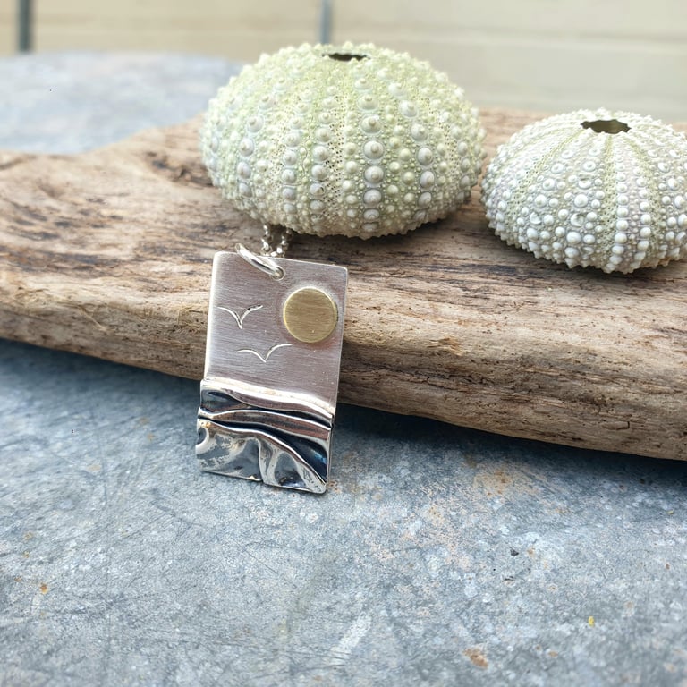 Silver beach, sea coast pendant, with brass sun and seagulls