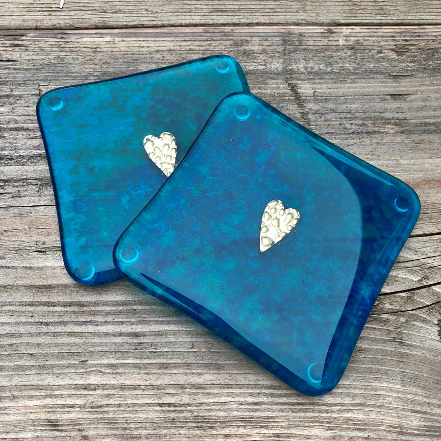 A pair of Dark Teal Fused Glass Coasters  with Brass Heart