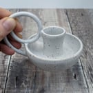 White ceramic taper candle holder in speckled clay