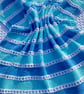 Pale blue and aqua striped baby blanket in 100% cotton 