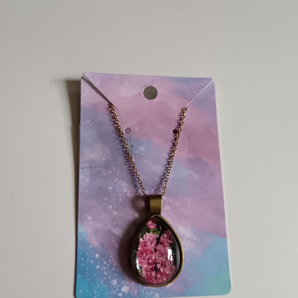 Pink flowers in bloom teardrop photography necklace 