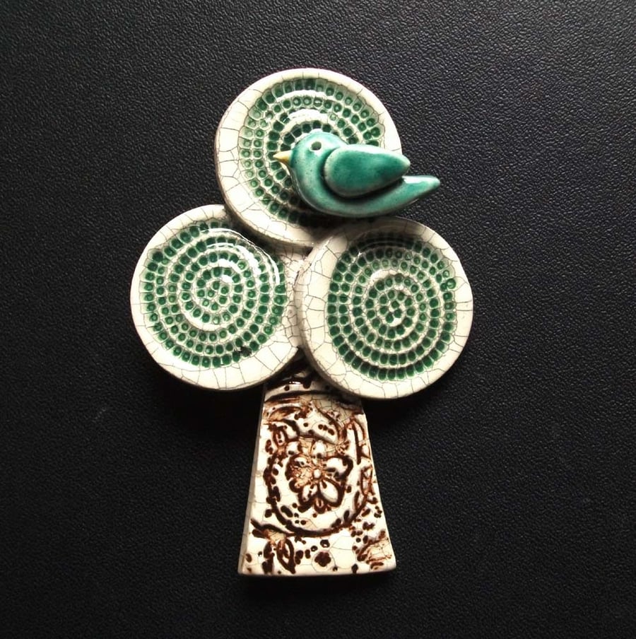 Little bird in a tree ceramic brooch